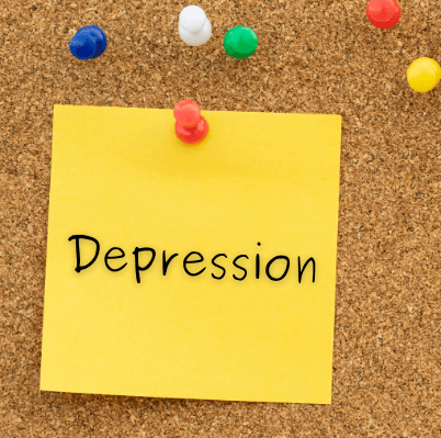 A photo of a post-it on a corkboard that says depression